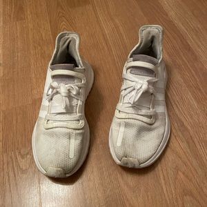 White adidas sneakers.